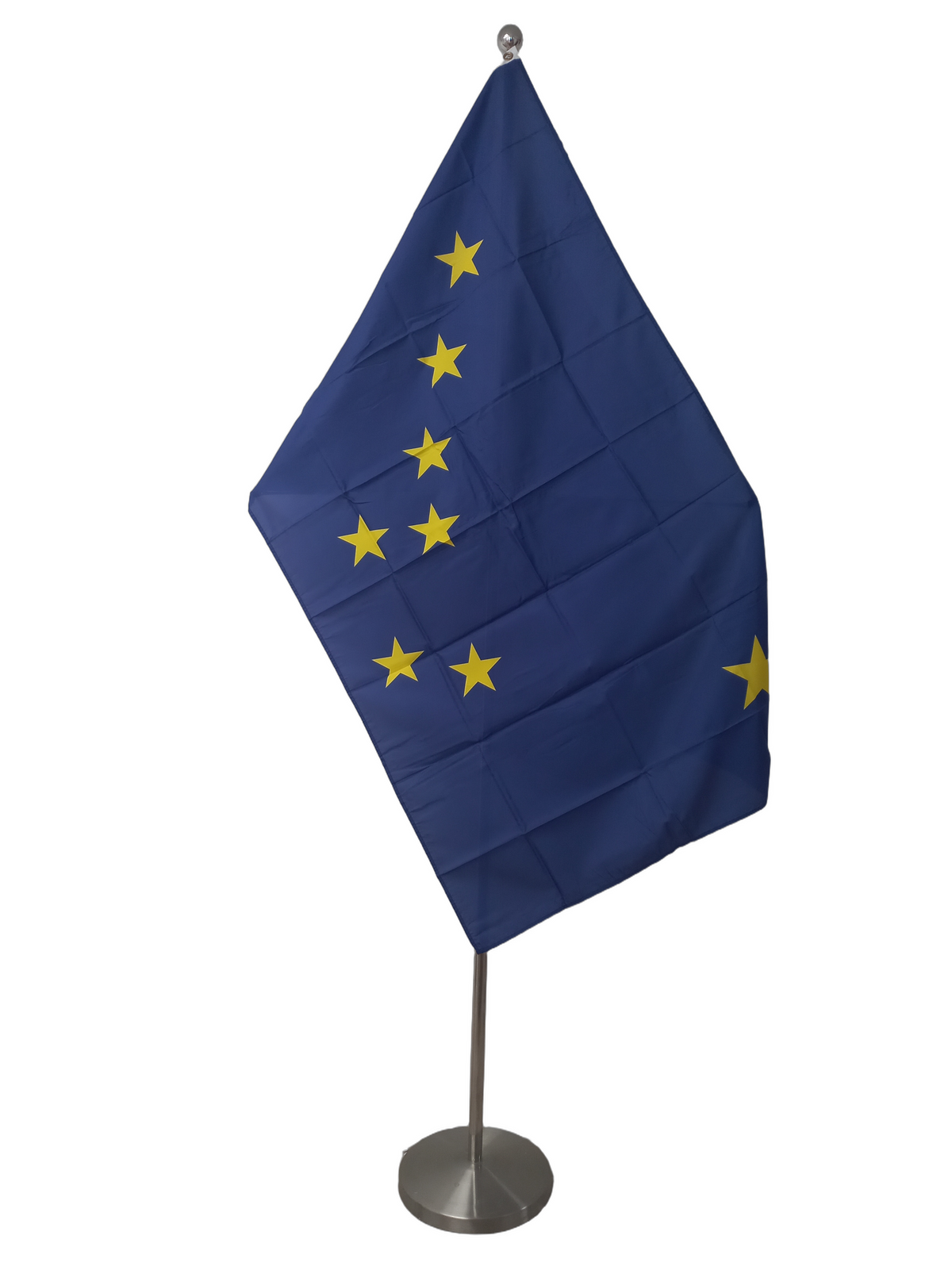 Flag of Alaska with a dark blue field and a constellation of stars forming a pattern. On a ceremonial pole.