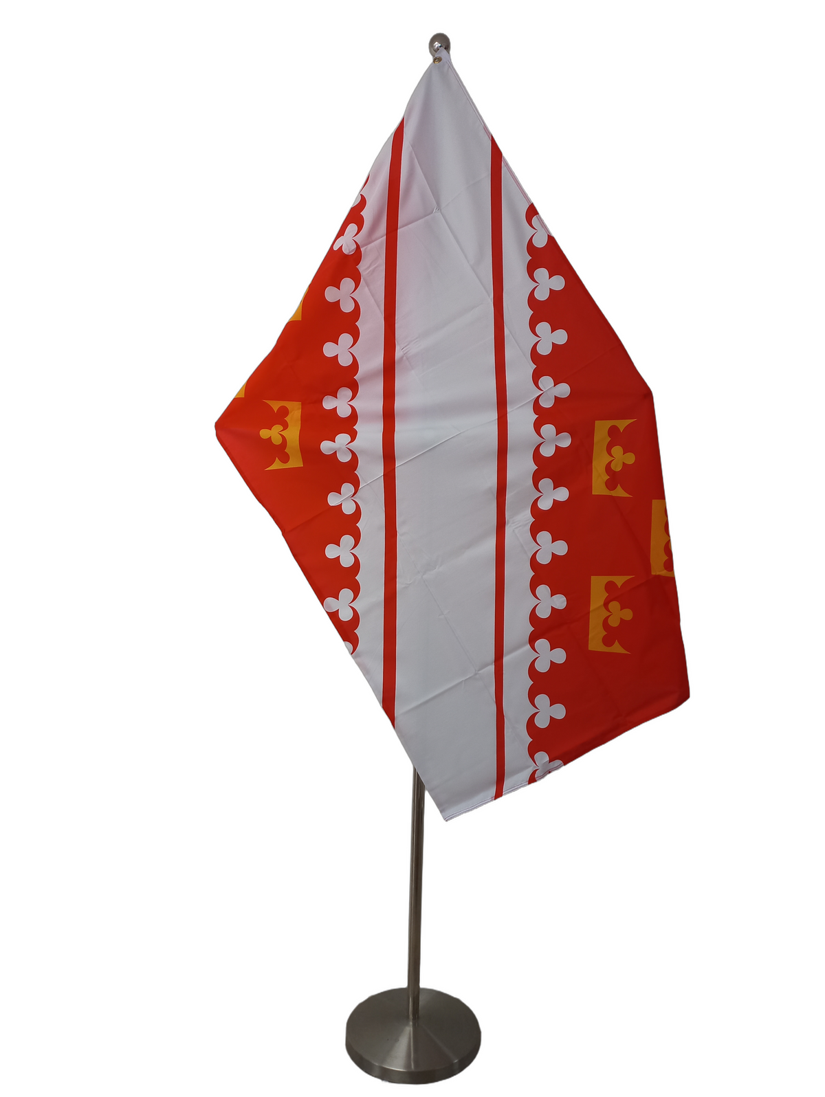 Flag with red and white diagonal stripes, yellow crowns, and white floral patterns on a white background. On a ceremonial pole.