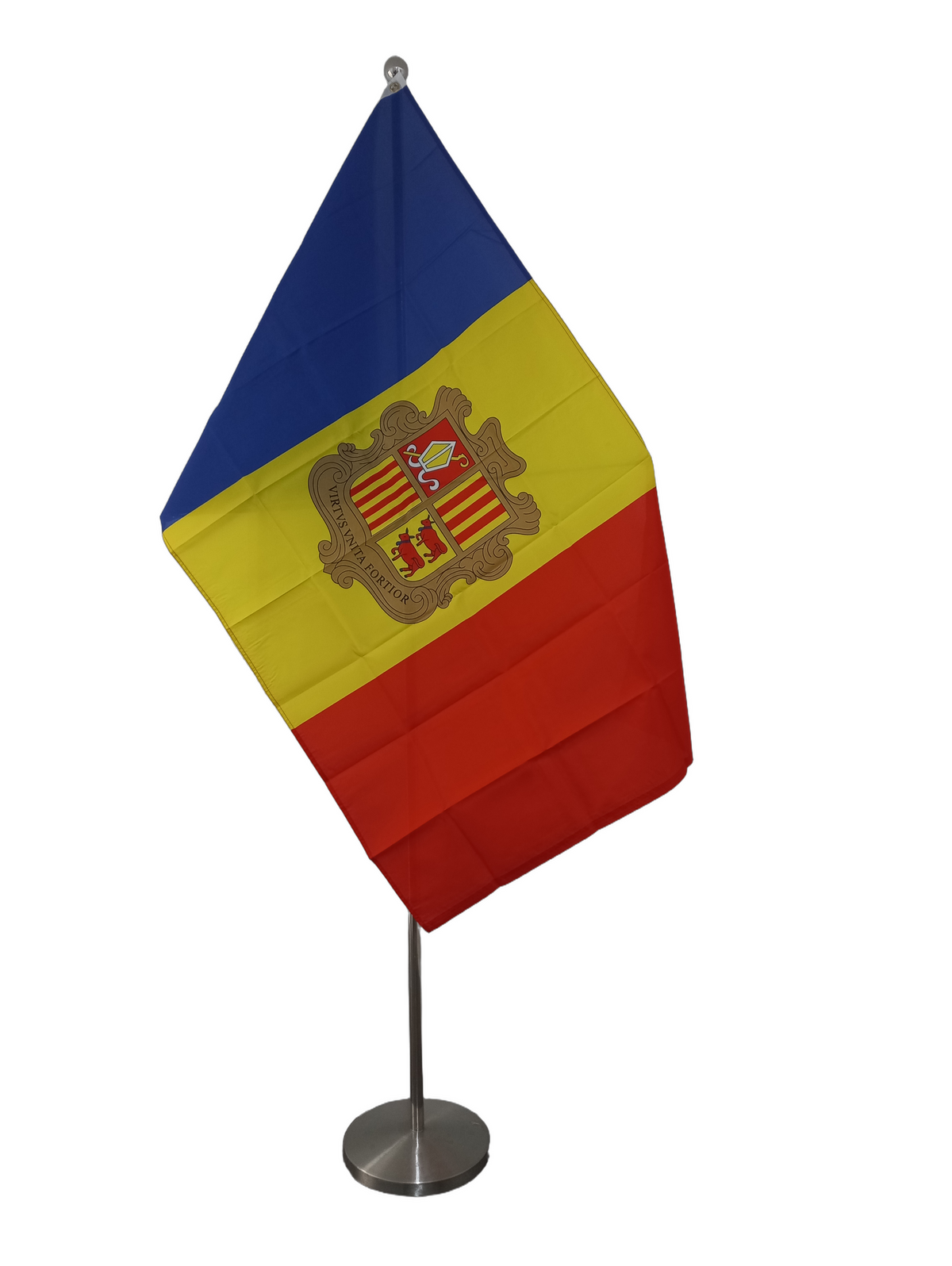 Flag of Andorra featuring vertical stripes of blue, yellow, and red with the national coat of arms in the yellow stripe. On a ceremonial flagpole.