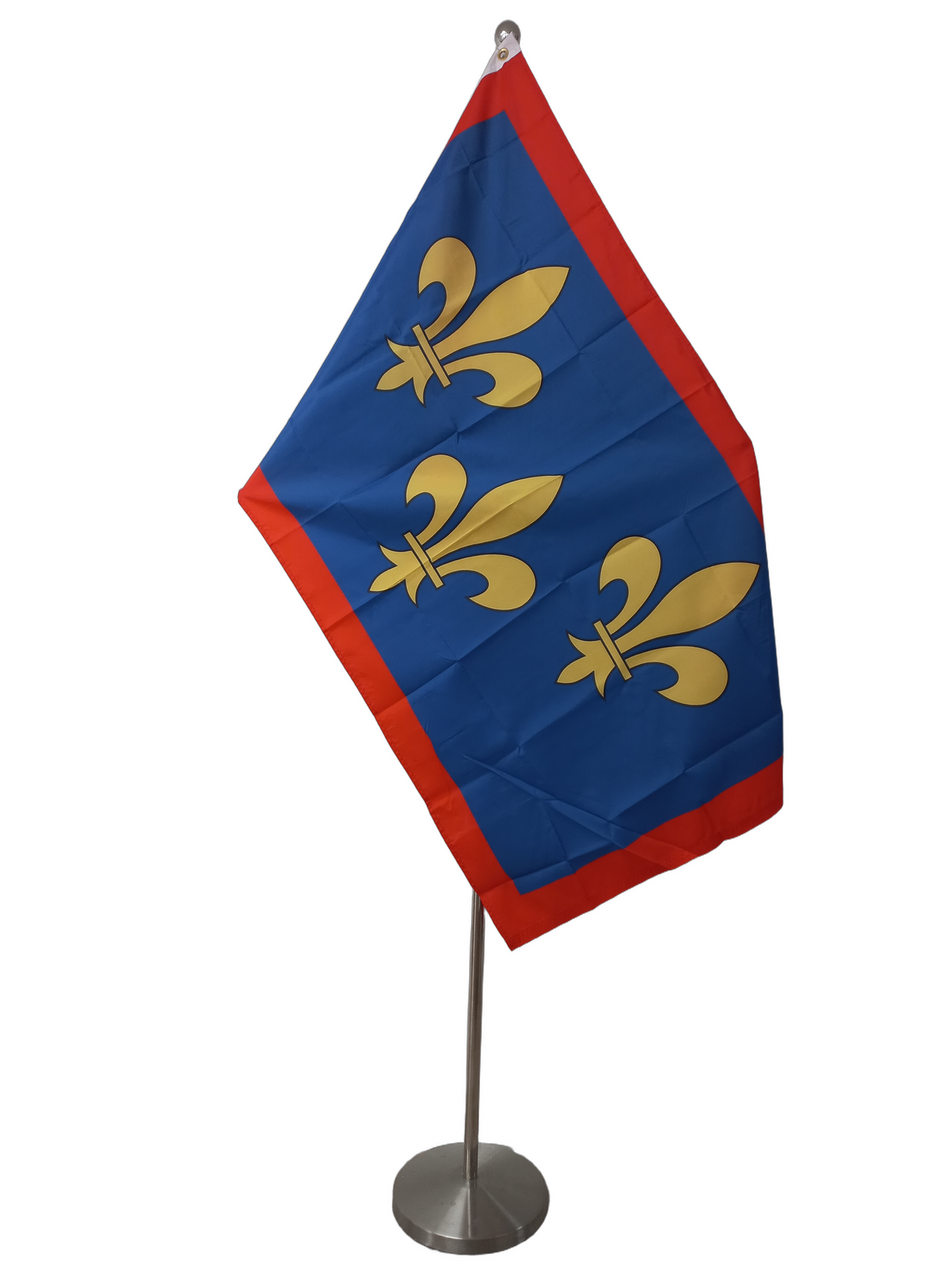 A flag featuring a blue background with three yellow fleurs-de-lis and a red border at the top. On a ceremonial flagpole.