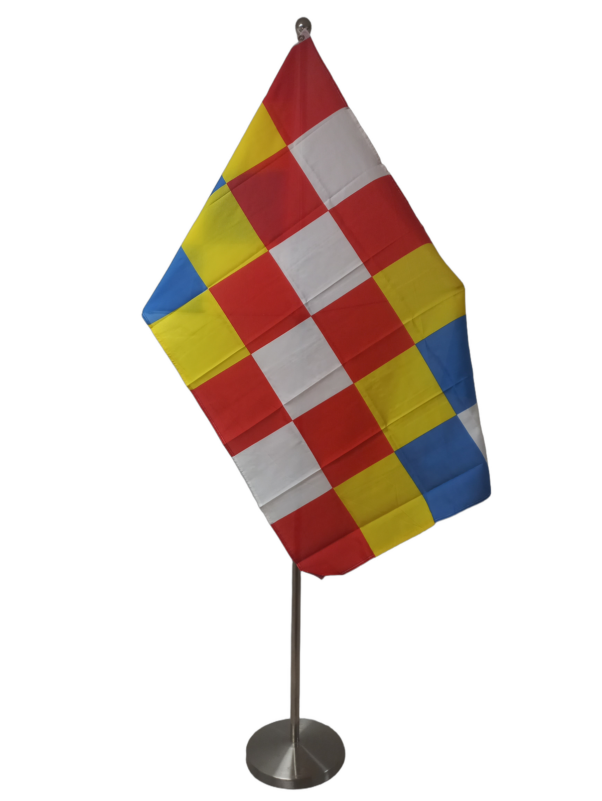 A flag with a checkerboard pattern of red, blue, and yellow squares, with two metal grommets for flying. On a ceremonial flagpole.