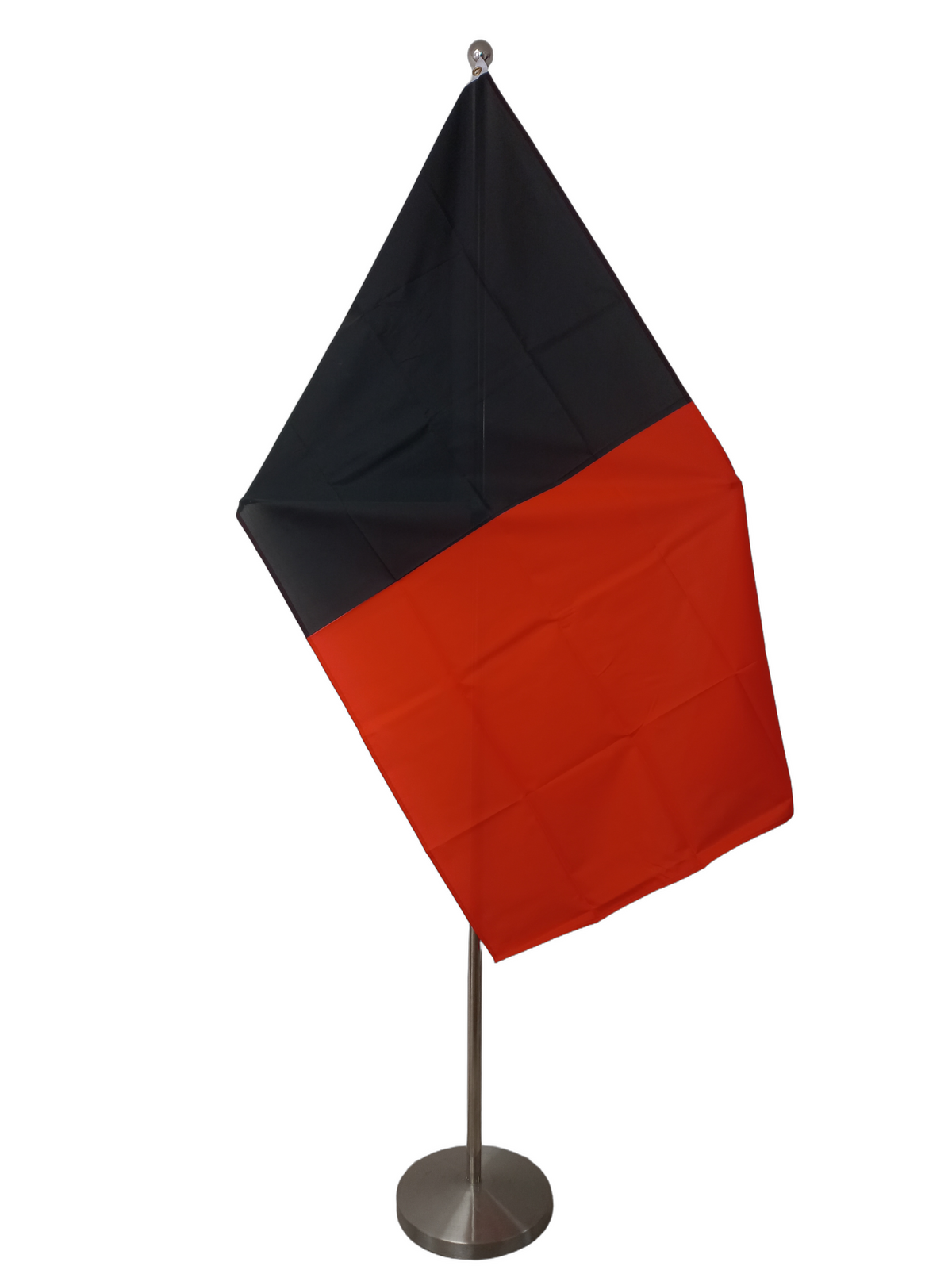 A flag featuring a black stripe on one side and a red stripe on the other, with two metal grommets for hanging. On a ceremonial flagpole.