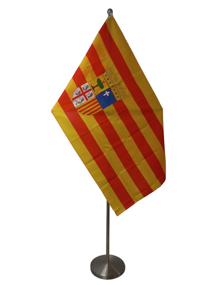 Flag of Aragon, Spain, with horizontal red and yellow stripes and a coat of arms featuring a crown and floral elements in the upper quarter. On a ceremonial flagpole.