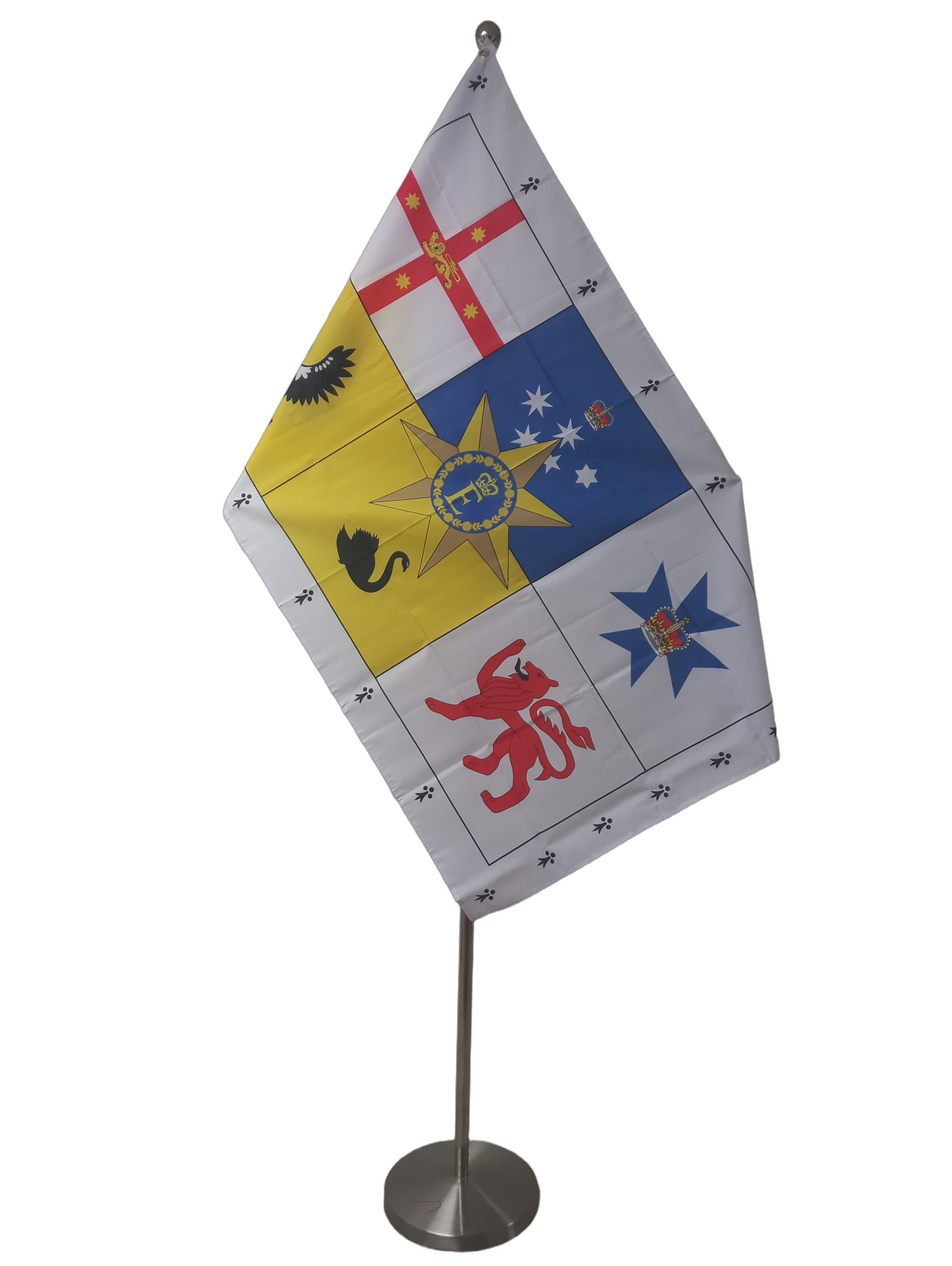 A square heraldic flag design with a white border and six colored panels: red and white St George's cross, blue field with white stars and crown, blue seven-pointed star, yellow eagle, black swan, and red lion rampant. On a ceremonial flag pole.
