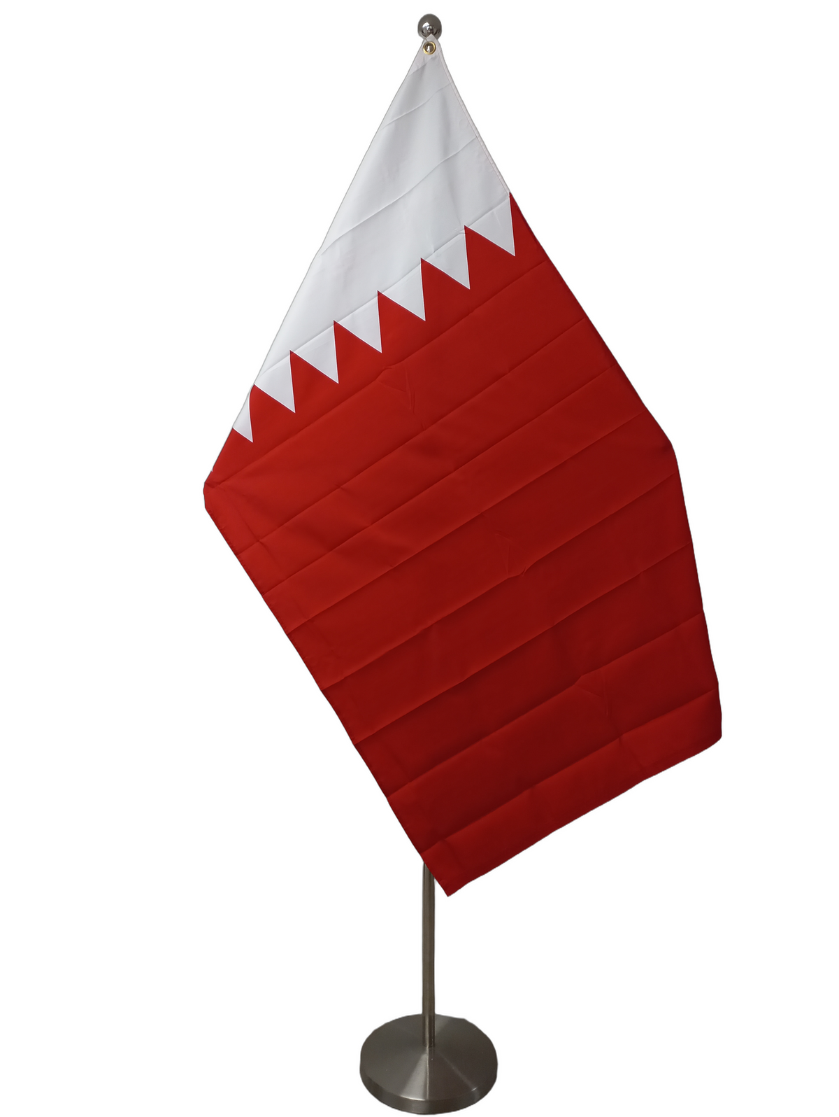 The old flag of Bahrain. A rectangular flag with horizontal red and white bands. More bands than the flag of Bahrain. On a ceremonial flag pole.