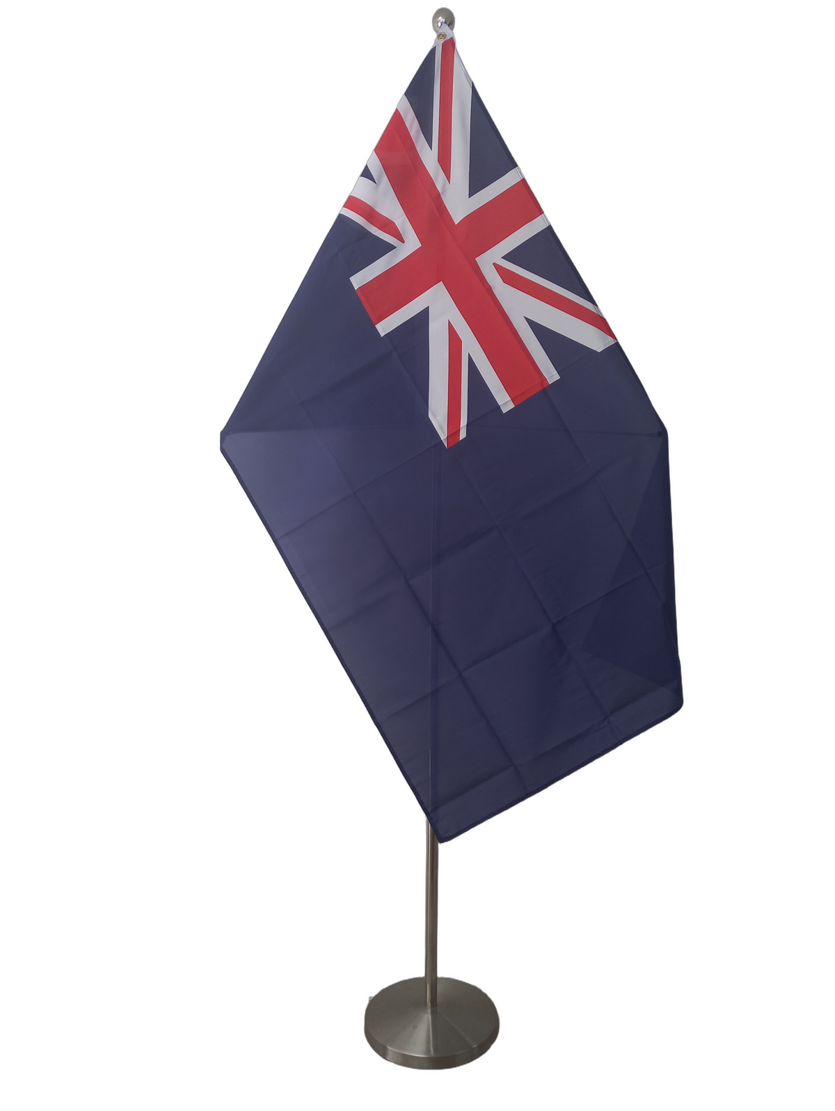 British Blue Ensign, a blue background flag with the union jack in the upper left corner. On a ceremonial flag pole.