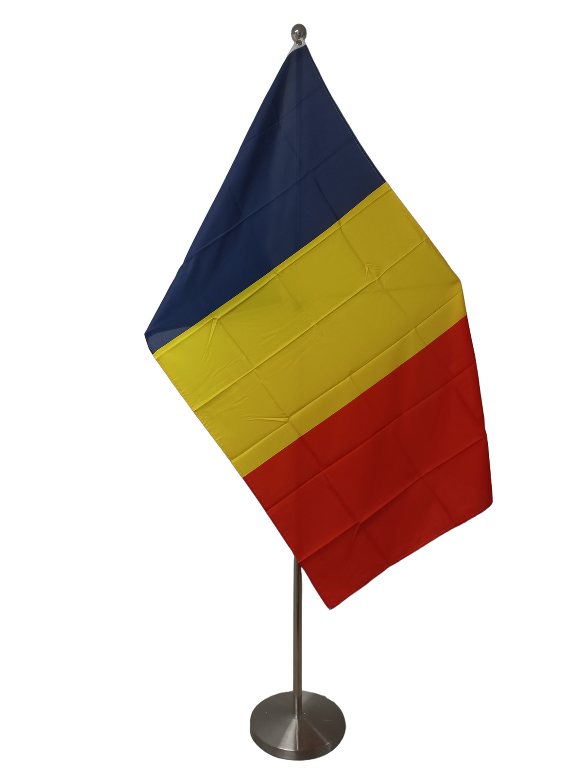 Flag of Chad with vertical stripes in blue, yellow, and red, with two metal grommets for flying. on a ceremonial flag pole.