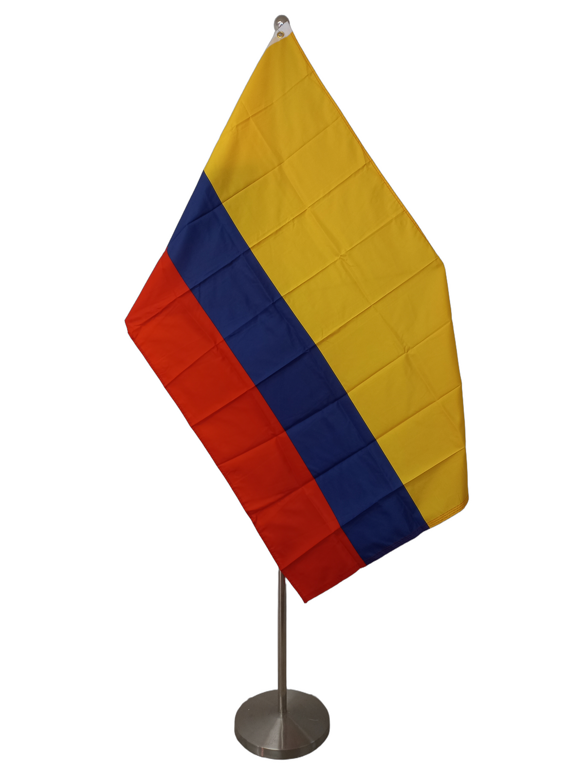 Flag of Colombia with horizontal stripes in yellow, blue, and red. The yellow stripe is twice as large as the red and blue stripes. On a ceremonial flag pole.