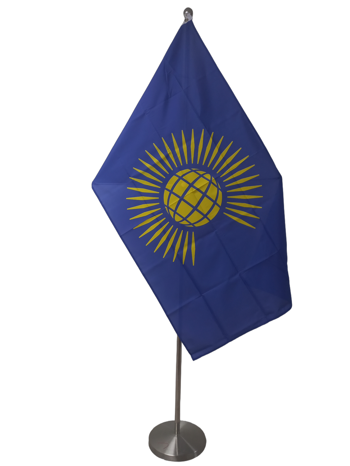 Flag of the Commonwealth with a blue field and golden sun rays from a stylised yellow world. On  a ceremonial flag pole.