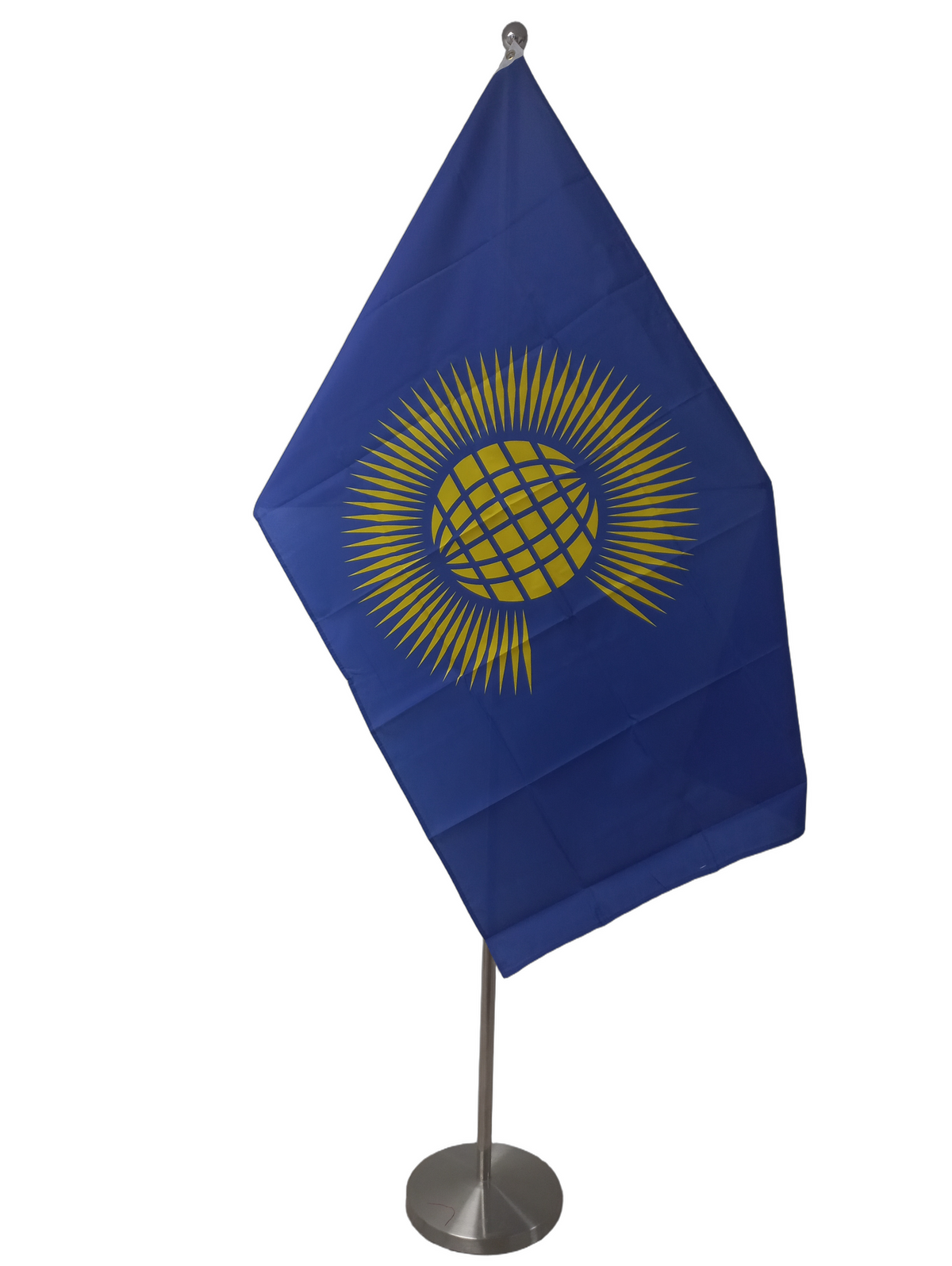 Old flag of the Commonwealth with a blue field and golden sun rays from a stylized yellow world. On a ceremonial flag pole.