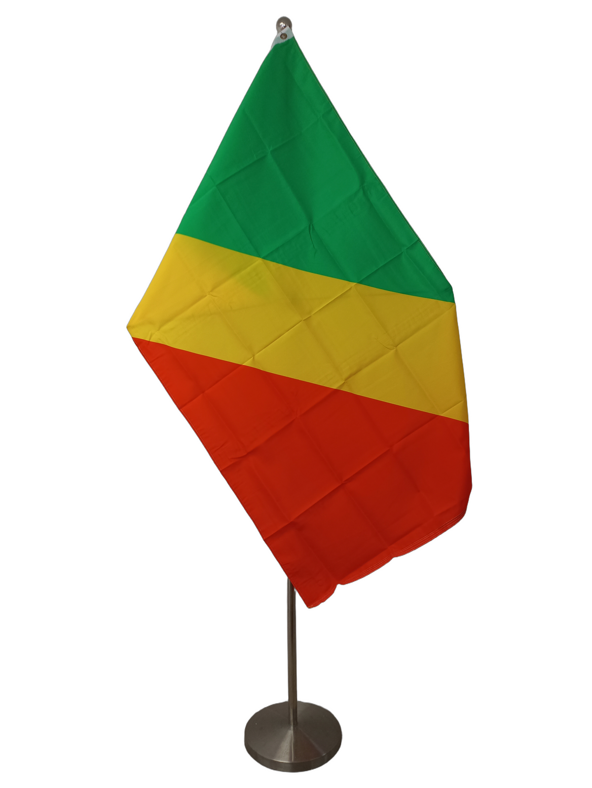 The flag of Congo Brazzaville, a green and red flag separated by a thick diagonal yellow band. On a ceremonial flag pole.