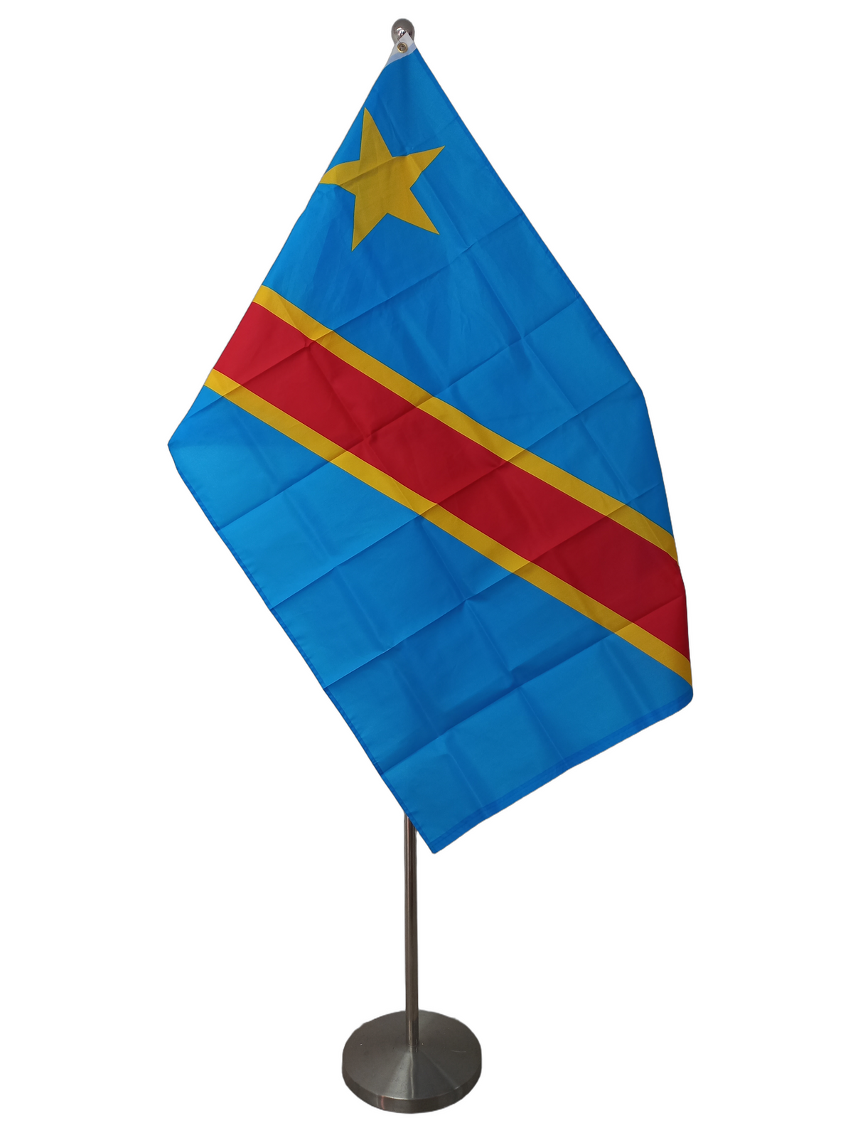 Flag of Democratic Republic of Congo, featuring a yellow star on a blue background with a red diagonal stripe, with two metal grommets for flying. On a ceremonial flag pole.