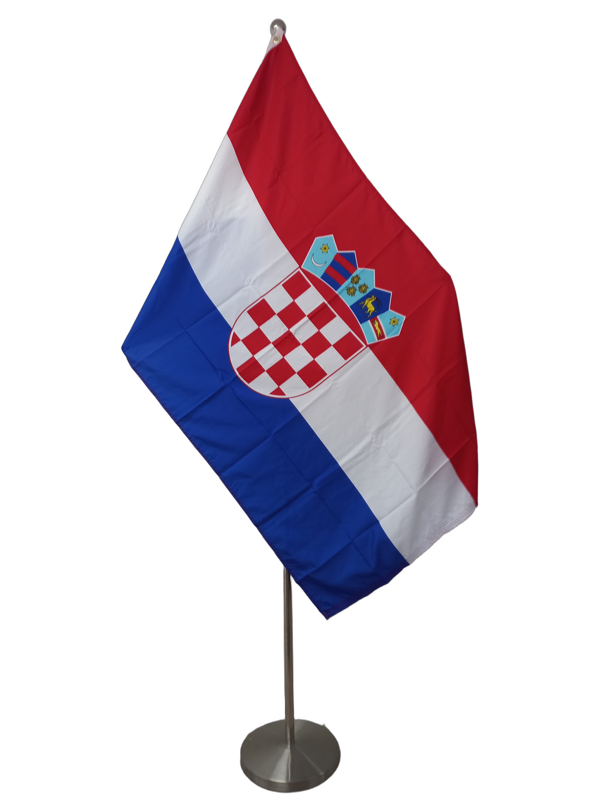 Flag of Croatia with red, white, and blue colors and the national coat of arms in the center, featuring two metal grommets for flying. On a ceremonial flag pole.