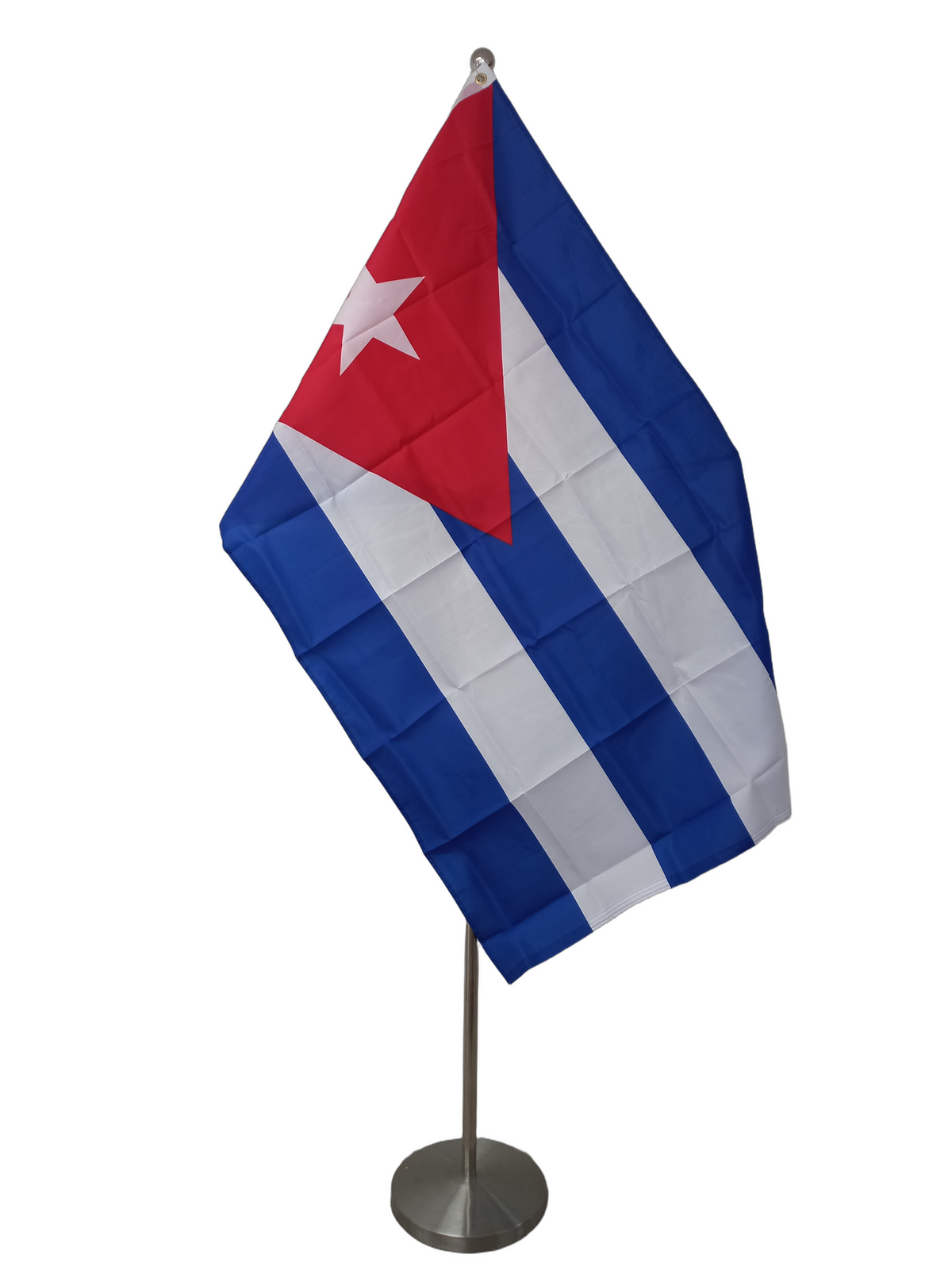 Flag of Cuba with horizontal blue and white stripes and a red triangle with a white star on the left. On a ceremonial flag pole.