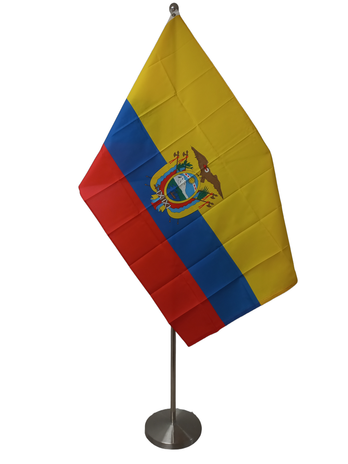 Flag of Ecuador with horizontal stripes in yellow, blue, and red with a national emblem in the center, two metal grommets for flying. On a ceremonial flag pole.