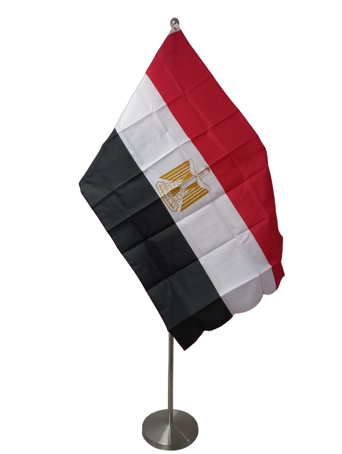 Flag of Egypt with horizontal red, white and black stripes with a golden eagle emblem in the center. On a ceremonial flag pole.