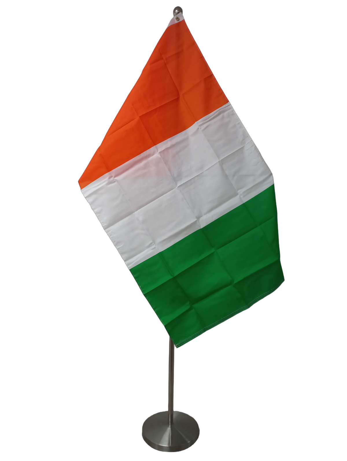 The flag of Côte d'Ivoire, also known as Ivory Coast, featuring a vertical stripes of orange, white and green. On the ceremonial flag pole.