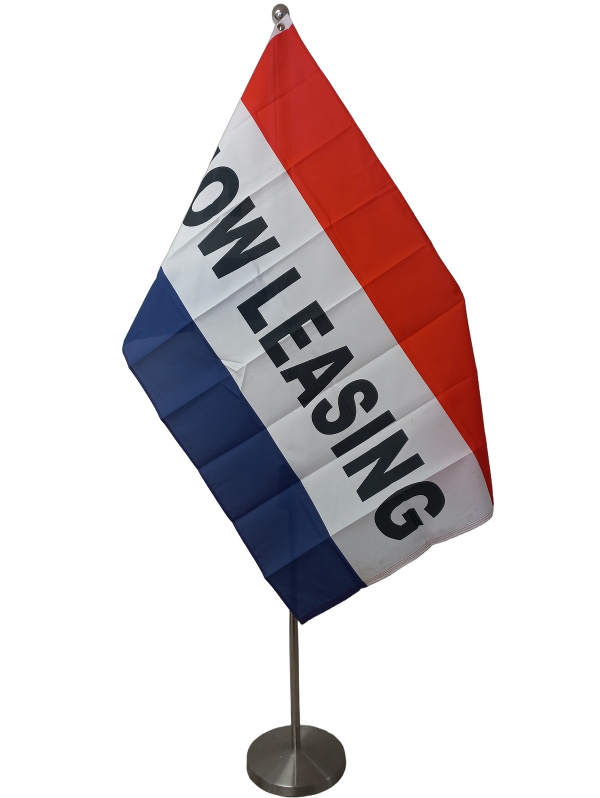 Tri-colour red, white and blue flag with advertising words "Now Leasing". On a ceremonial pole
